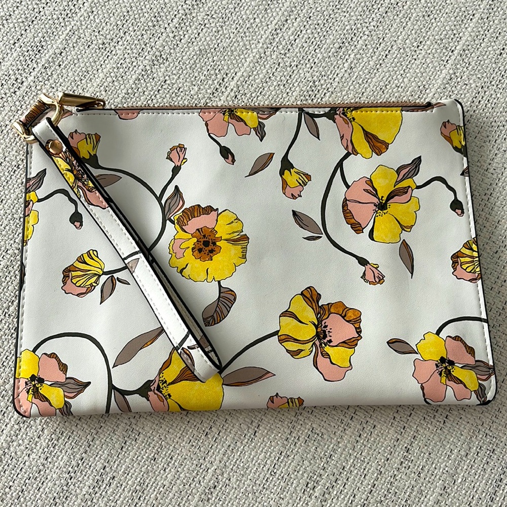 A New Day pleather clutch, never used.  Floral w/pink, yellow, grey, and orange.